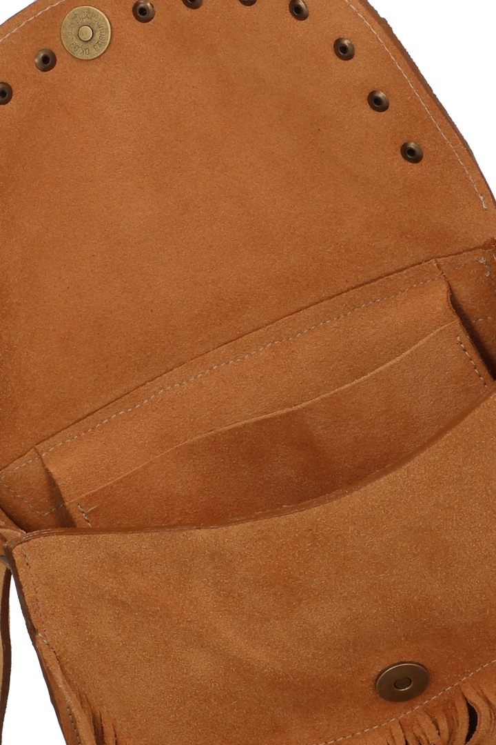 Close-up of a brown leather bag with fringes and metal studs on a white background