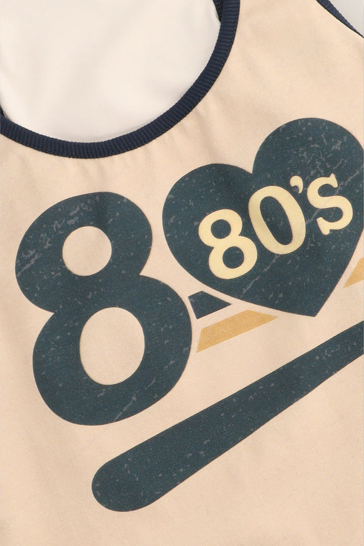 Beige sleeveless top with '80s' design on a white background