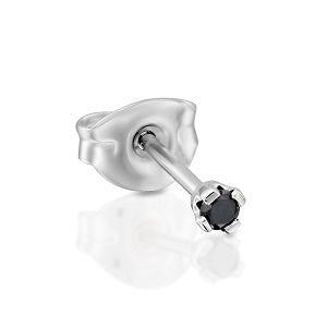 Single stud earring with black gemstone on a white background