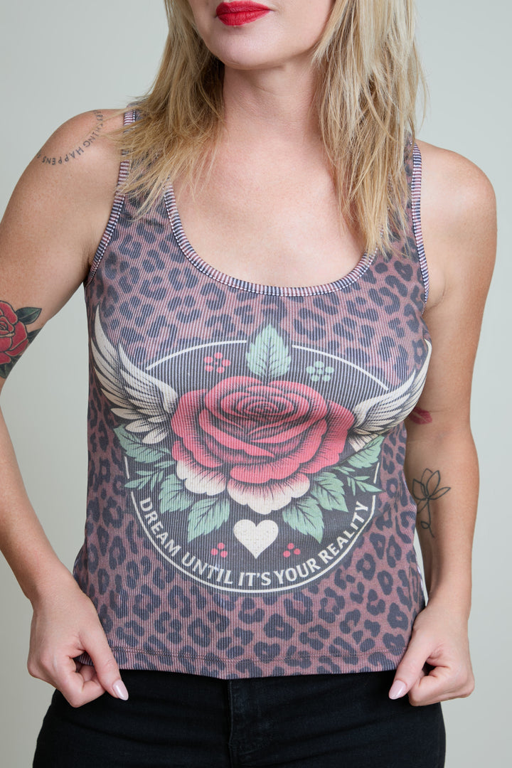 Woman wearing a tank top with a leopard print and floral design.