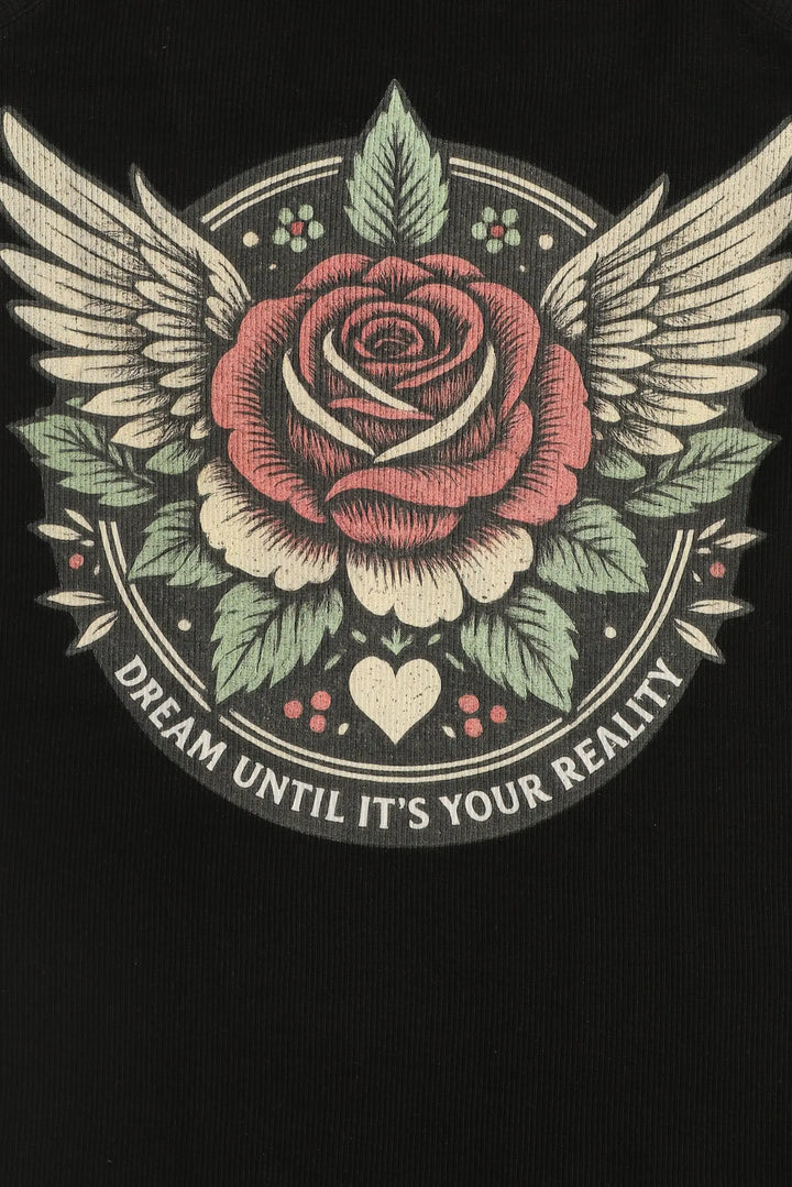 Decorative design with a rose, wings, and motivational text on a black background