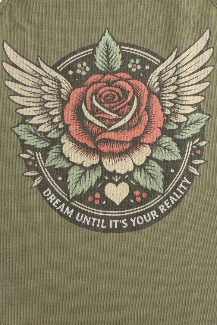 Rose with wings and leaves on a green background with 'Dream Until It's Your Reality' text.