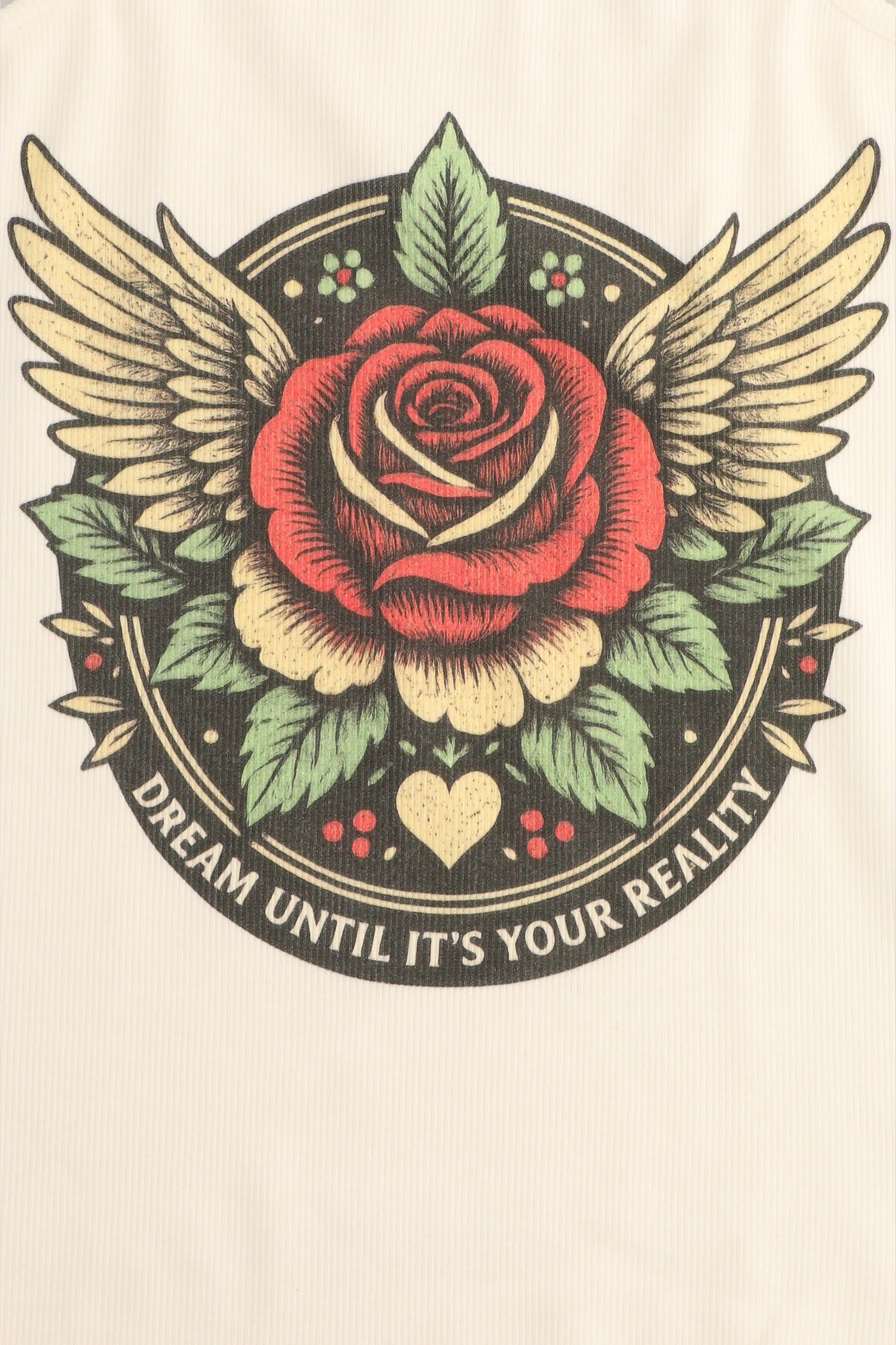 Rose with wings and leaves on a beige background with text 'Dream until it's your reality'.