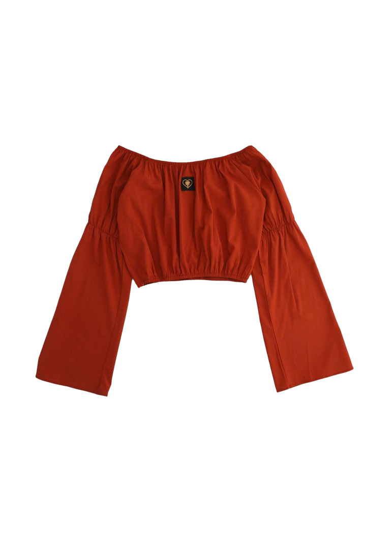 Red long-sleeve top on a white background