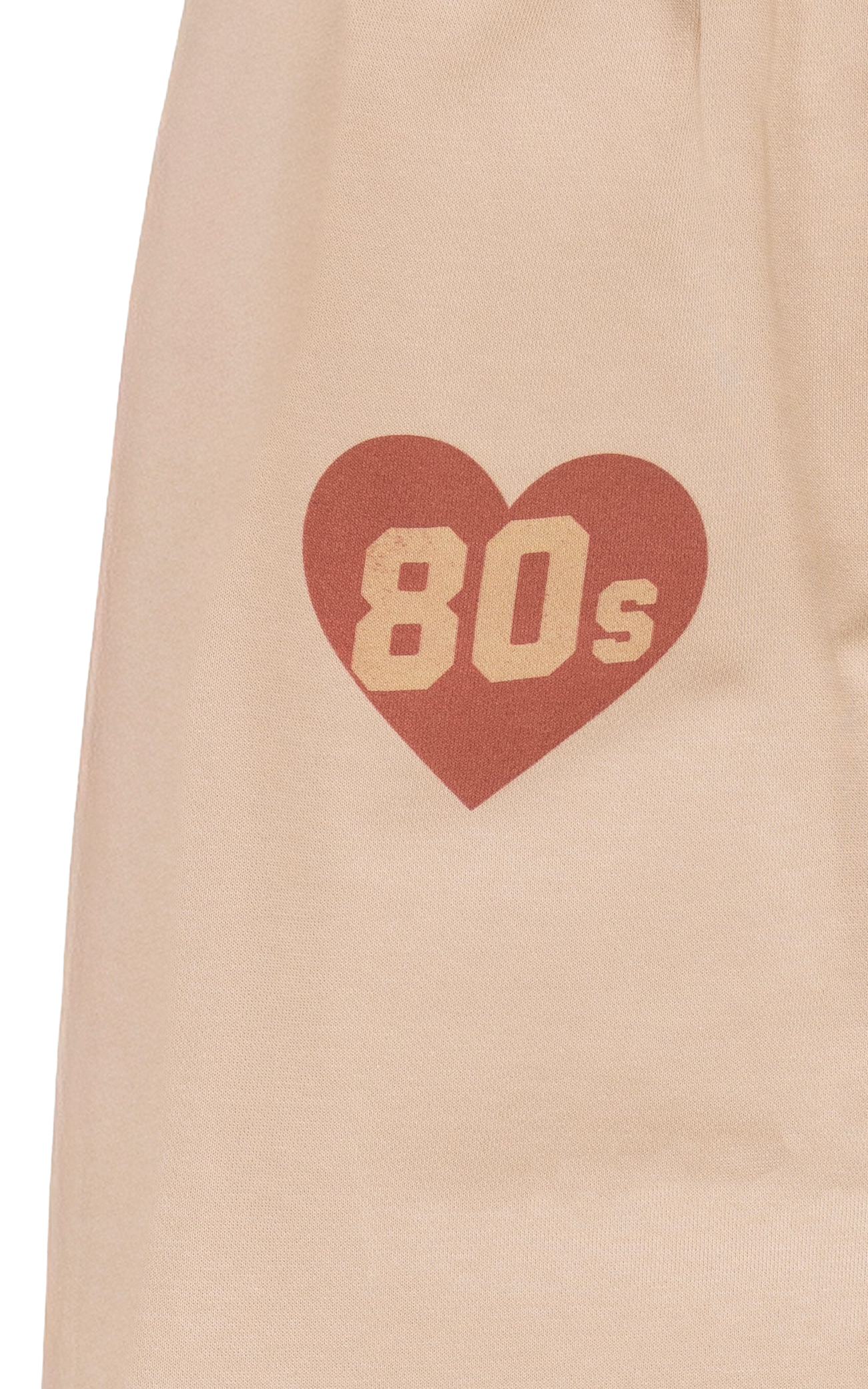 Heart-shaped design with '80s' text on a beige background