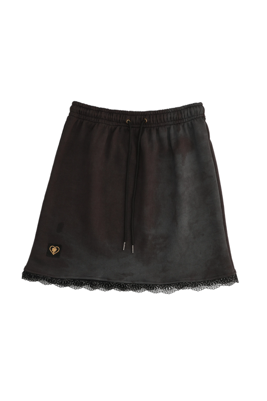 Black leather skirt with lace hem on a white background