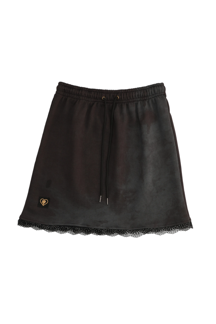 Black leather skirt with lace hem on a white background