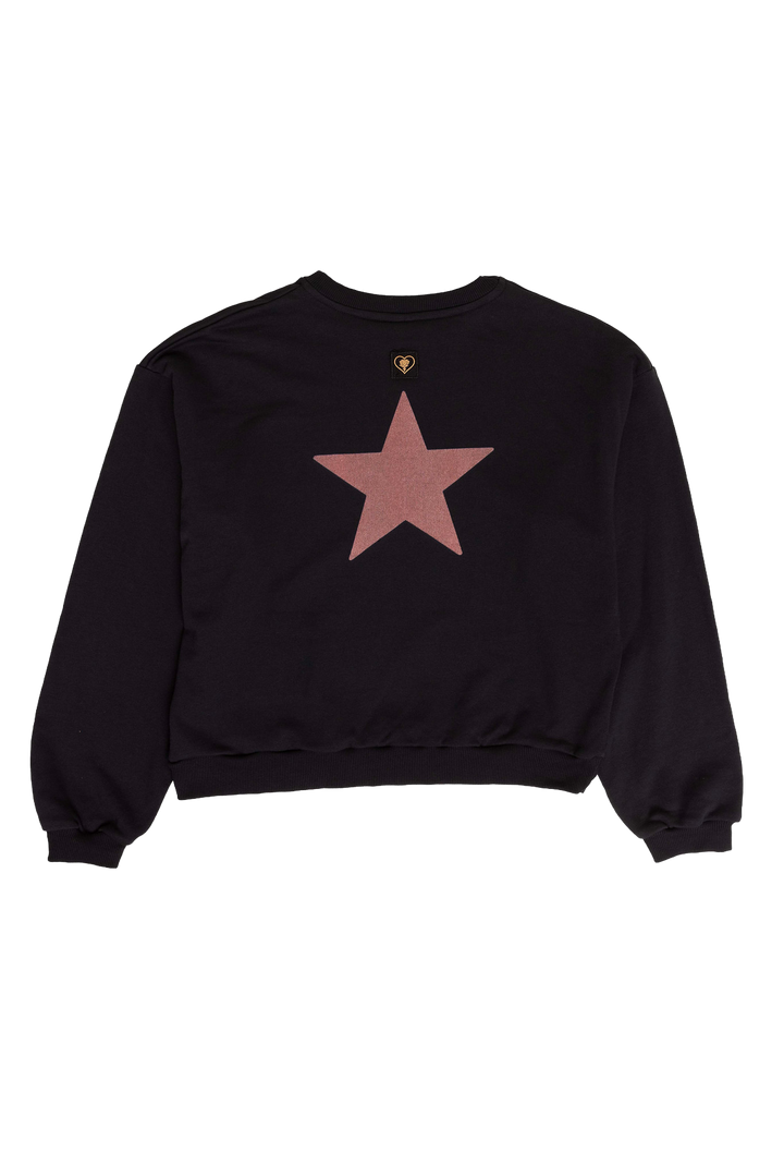Black sweatshirt with a pink star on a white background