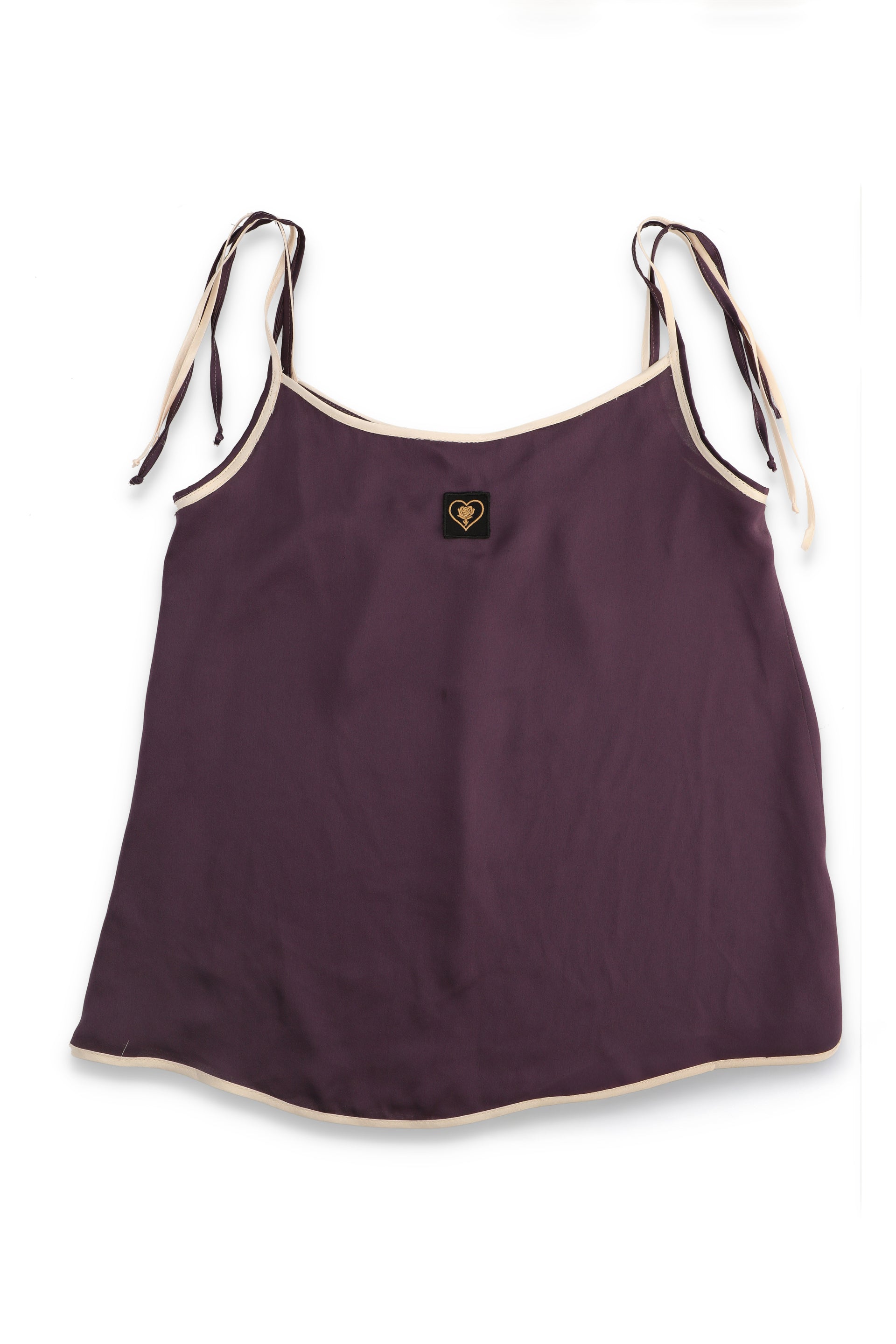 Purple tank top with white straps on a white background