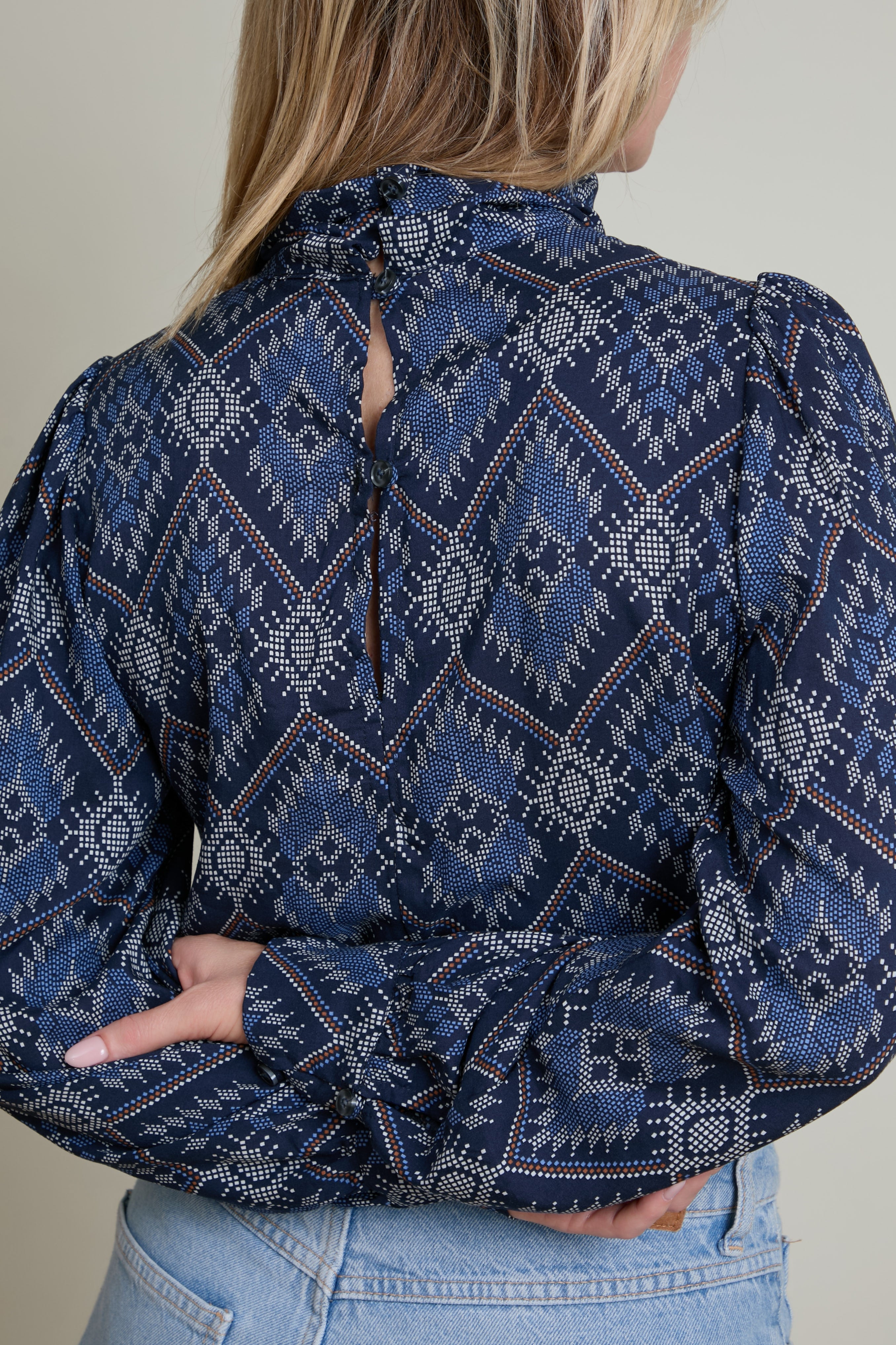 Purple tank top with white straps on a white background