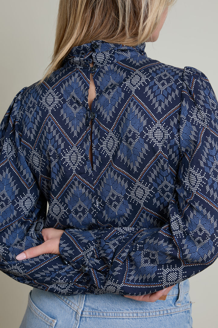 Purple tank top with white straps on a white background
