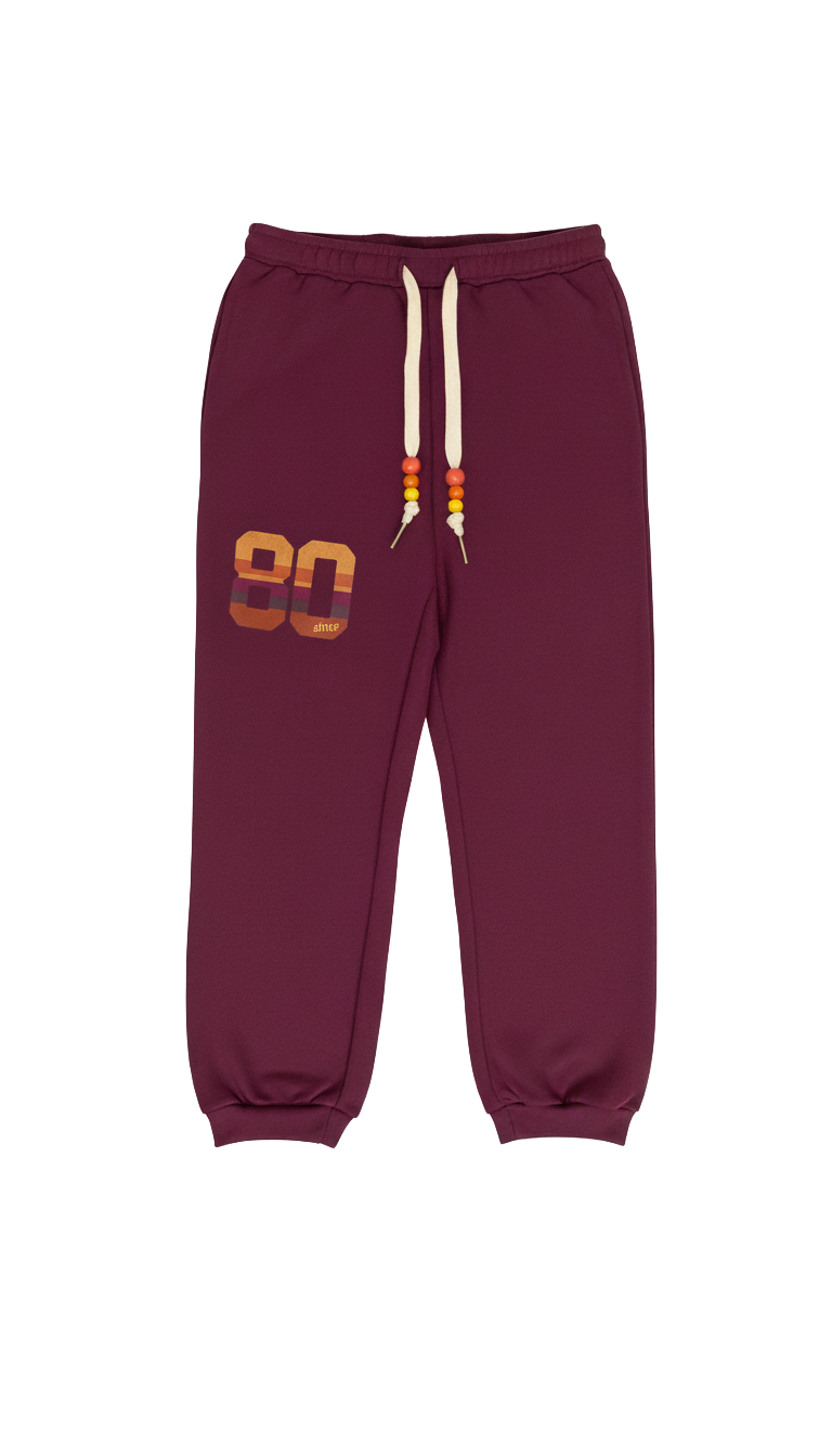 Maroon sweatpants with a number 80 on a white background