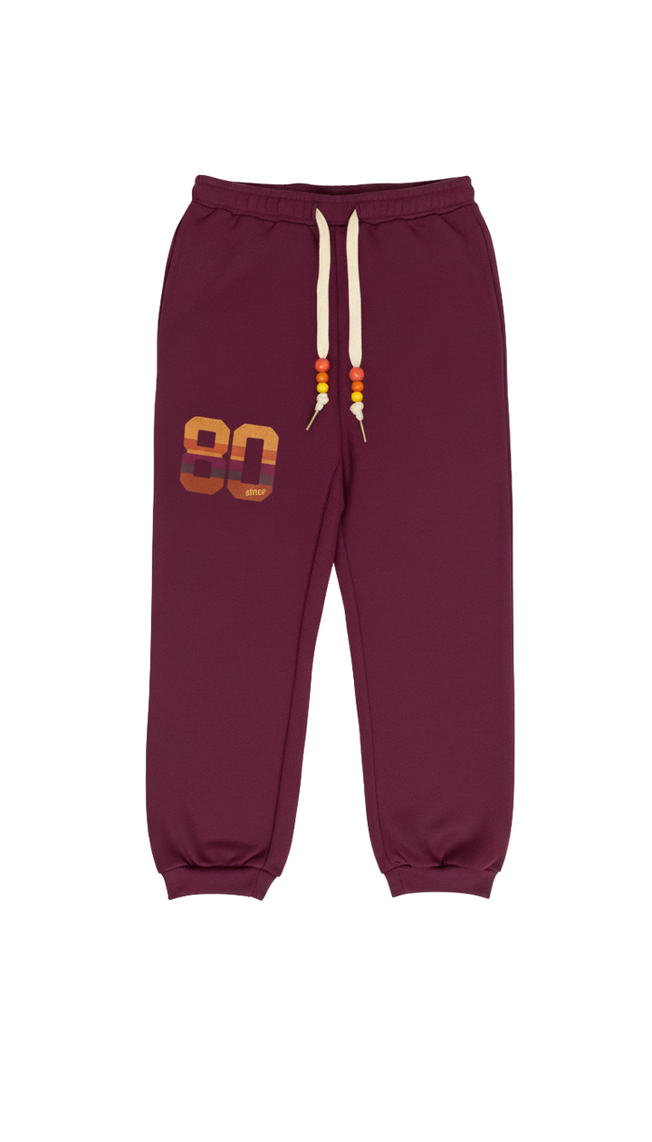 Maroon sweatpants with a number 80 on a white background