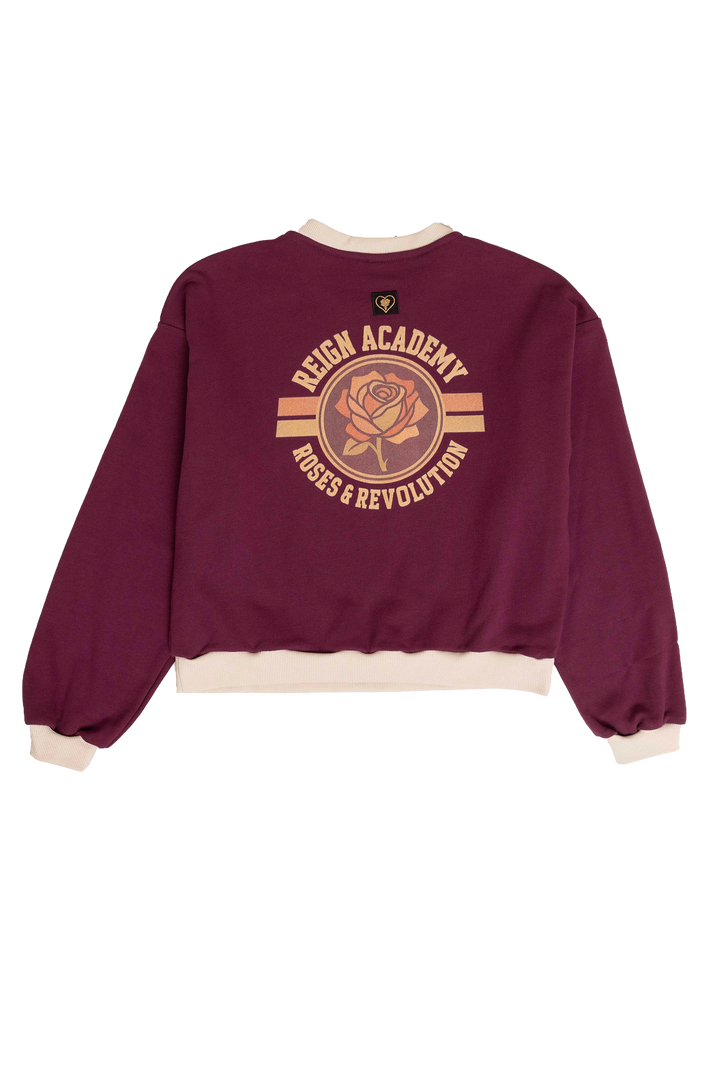 Maroon sweatshirt with rose graphic and text on a white background