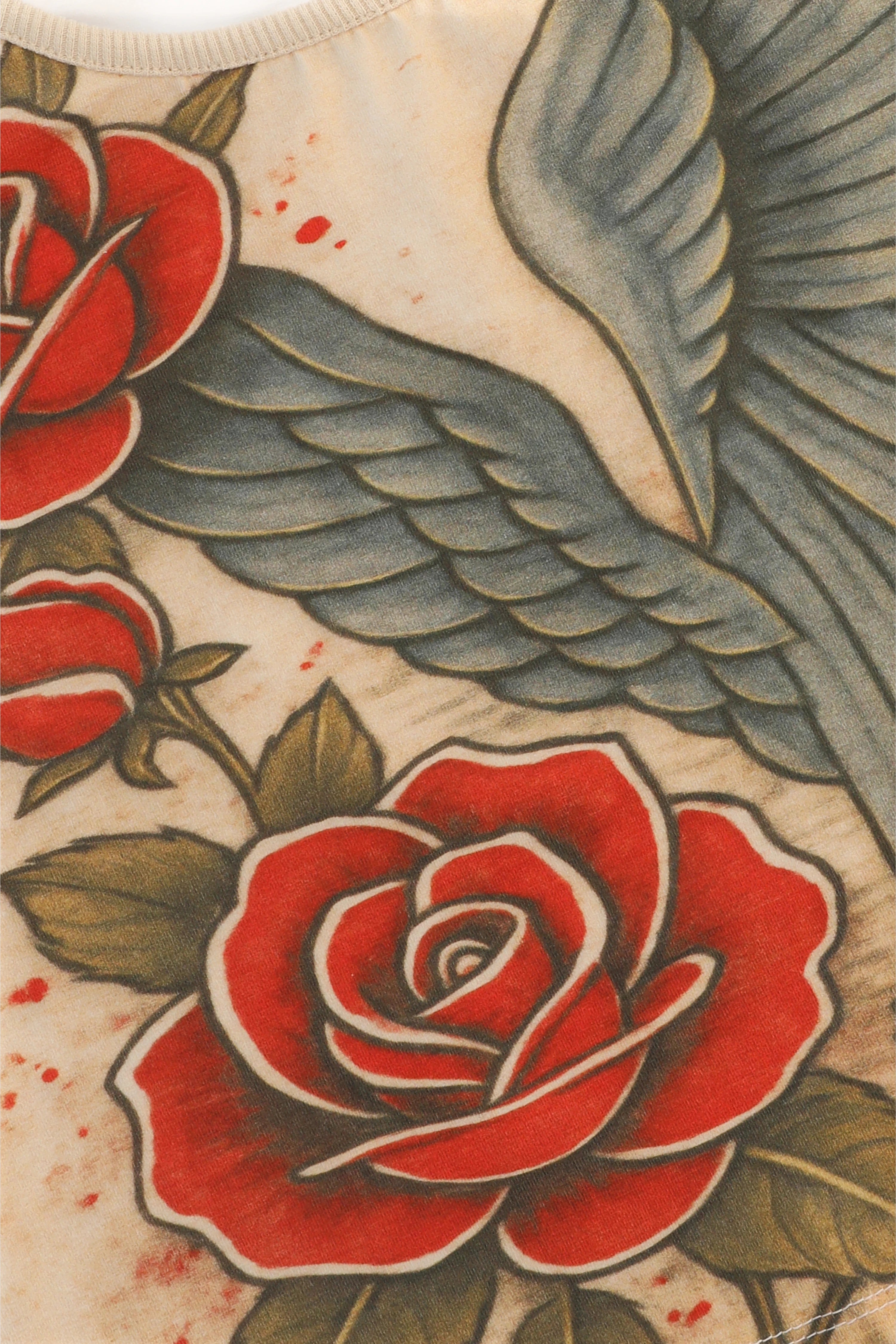 Traditional-style tattoo design with red roses and a wing on a textured background