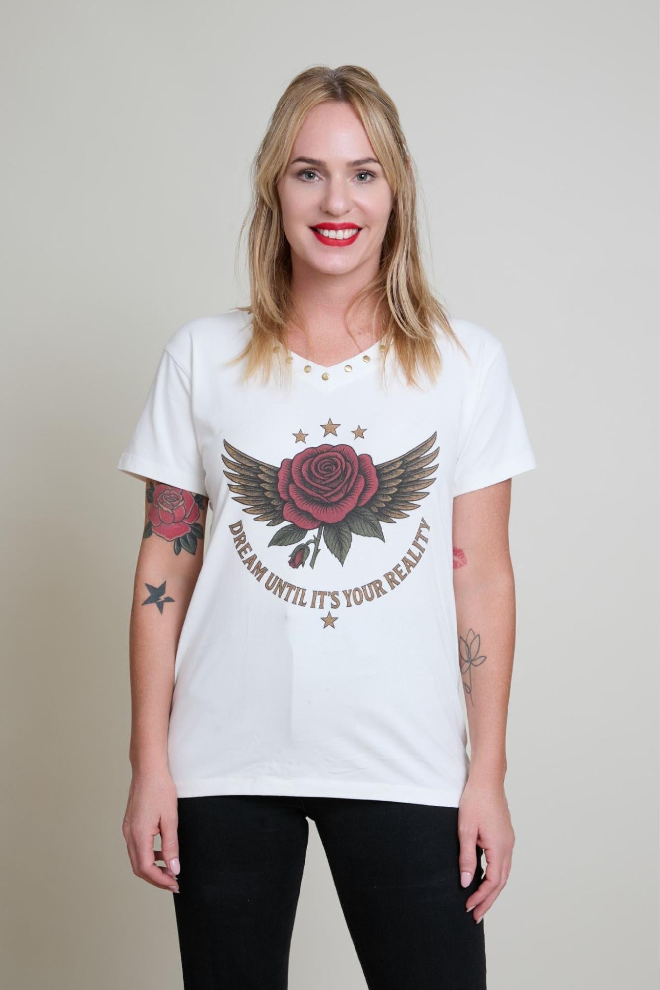 Woman wearing a white t-shirt with a graphic design and text on a plain background