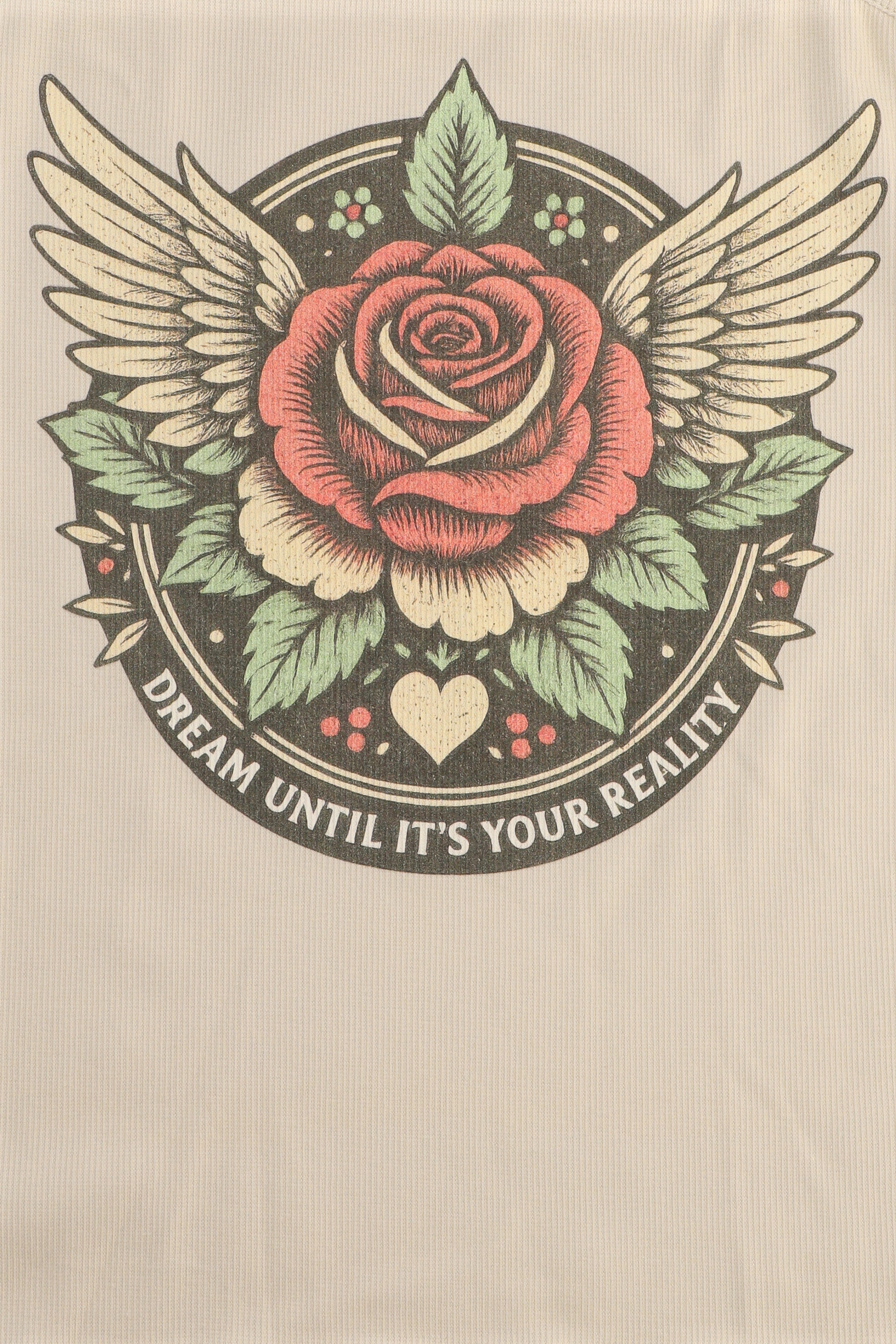 Rose with wings and leaves on a beige background with text 'Dream until it's your reality'.
