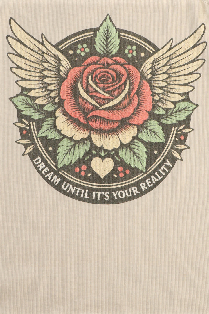 Rose with wings and leaves on a beige background with text 'Dream until it's your reality'.